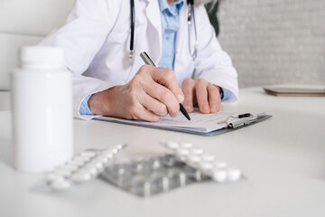 Fototapeta premium Doctor, hands or writing with script for medical prescription, diagnosis or notes at hospital. Healthcare, person or professional with documents or paperwork for pharmaceutical research at clinic