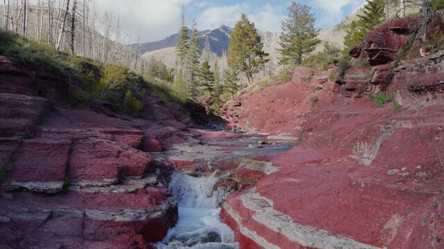Red Rock Canyon waterfall flowing through argillite in Waterton Lakes National Park
