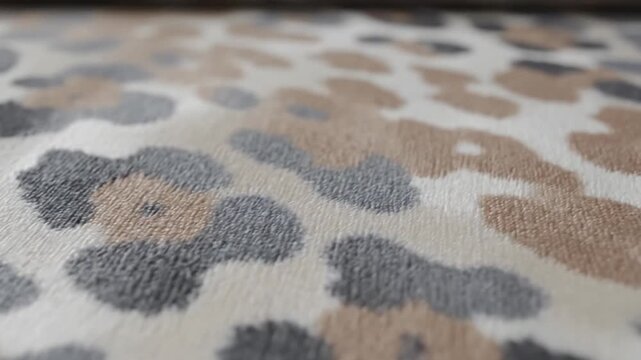 Close-up leopard print fabric pattern with textured surface