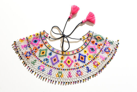 Traditional Ukrainian beaded necklace Sylyanka with colorful folk patterns on white background.