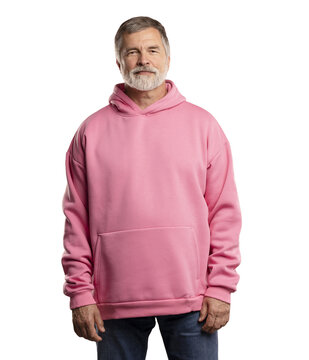 Caucasian smiling bearded mature man wearing pink hoodie on transparent background. Standing indoors