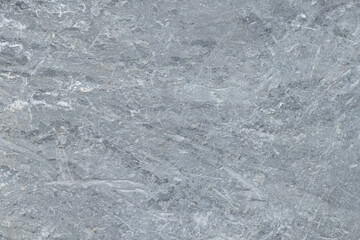 Obraz premium Natural Grey Slate Stone Texture Background with Scratched Surface,High-resolution close-up of a natural grey stone surface with rough texture, subtle mineral veins, and organic scratch patterns.