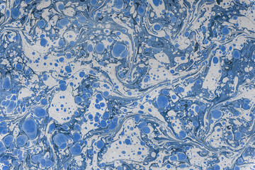 Blue marbling paper pattern creating abstract texture background © photology1971