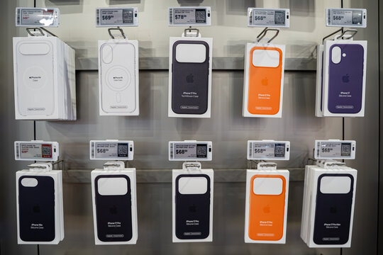 Apple iPhone cases on retail store display wall. Toronto, Canada - February 7, 2026.