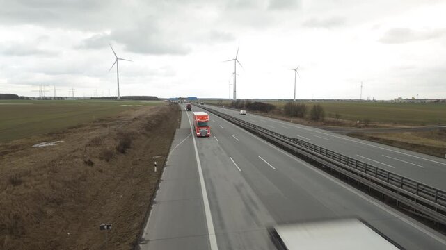 German Autobahn Traffic &ndash; Cars and Trucks Driving on Highway in Cloudy Weather, Transportation and Logistics Concept