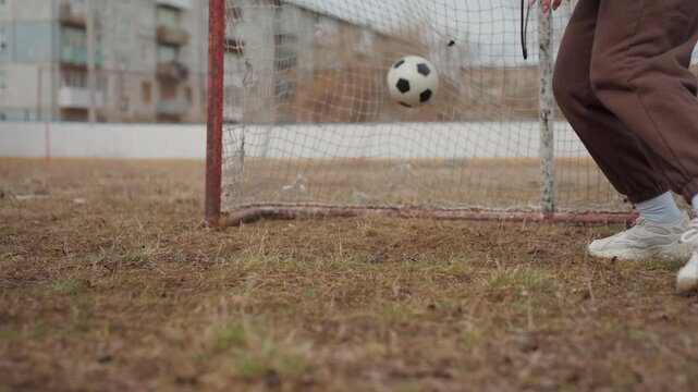 goalkeeper promptly adjusts stance in response to challenging game conditions, attentive goalkeepers execute rapid lateral movements to maintain optimal positioning on uneven surfaces