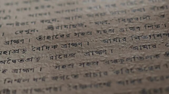 Flipping through ancient sacred scriptures written in sanskrit