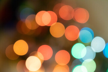 Fototapeta premium Festive background of multicolored bokeh in warm colors