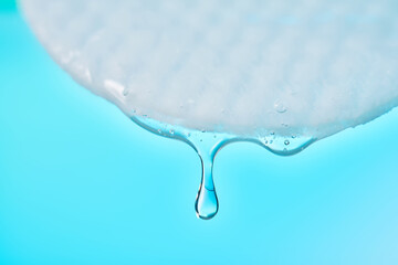 Cotton pad soaking liquid dropping for skin care © Marevgenna