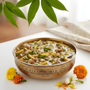 Vibrant Ugadi Pachadi, the symbolic six-taste dish for the South Indian New Year, beautifully presented in an ornate brass bowl with mango leaves and marigold flowers, celebrating Hindu traditions.