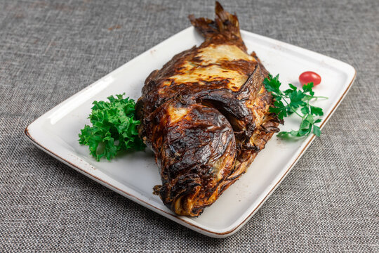 Close-up of Crispy Fried Carp (Sazan): Authentic Homemade Dish in Natural Light