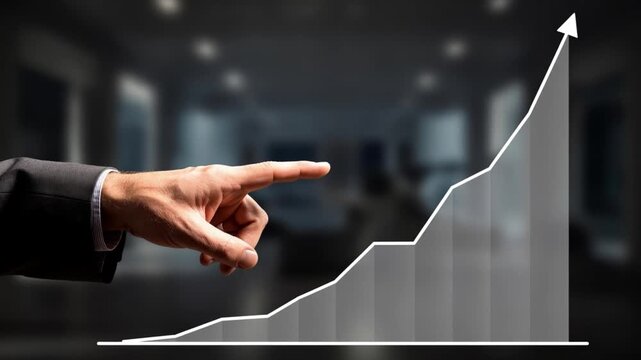 Businessman pointing to growing graph chart with arrow pointing up indicating success and growth in finance and economy