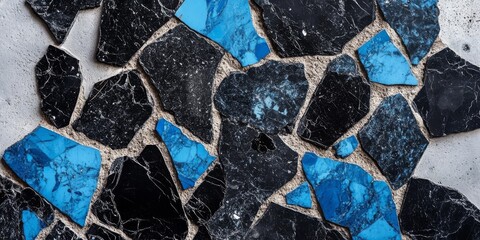 Colorful terrazzo flooring featuring a mix of black, gray, and blue stone fragments, showcasing unique patterns and textures, ideal for modern interior design and architectural applications