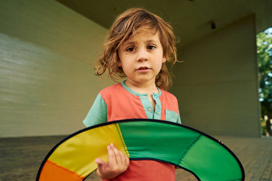 Young child holding kite