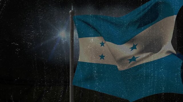 Hoisted flag lifting, curling, flipping, inflating and collapsing from rising wind gusts under lens