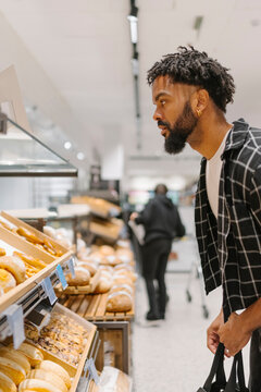 Enjoying Fresh Pastries in Indoor Bakery
