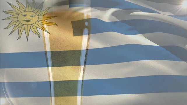 Breeze causing thin Uruguay flag waving at front, shifting showing hiding beer glass as flag motif