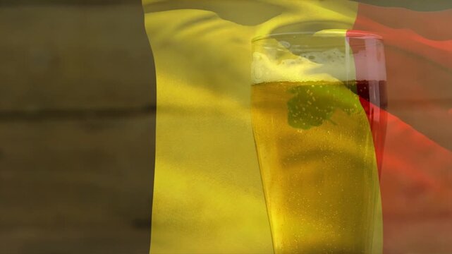 Off-frame breeze moving tricolor flag, folds sweeping across beer glass, creating green glow