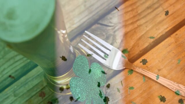 Clovers falling top-left, pint entering left, foam rising, fork staying angled, tint making festive