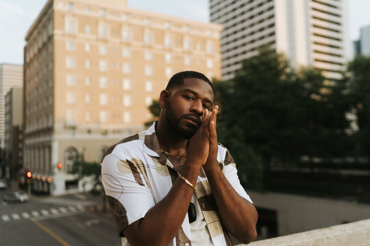 Portrait Of A Man Posing With Hands Together 
