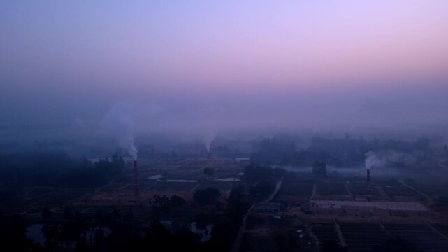 Aerial Drone View of Brick Kiln Factory with Industrial Smoke and Air Pollution in Rural Bangladesh 4k