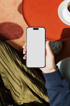 Phone Mockup With White Screen In Coffee Setting Red Table