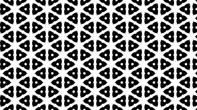 Seamless video pattern of small black and white geometric shapes moving in a repeating design