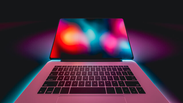 Laptop glows with vibrant neon lights in a dark setting