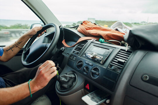 Hands on the steering wheel while driving a van