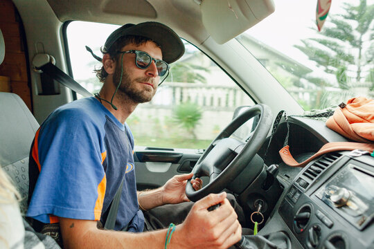Man driving a van on a road trip