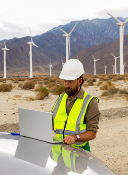 Alternative Wind Turbine Engineer  works outdoors 