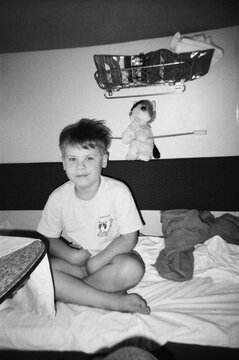 Sleepy boy sitting on a train 