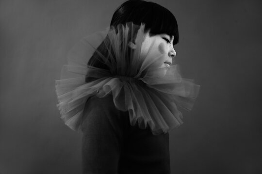 Stylish child in tulle collar indoor