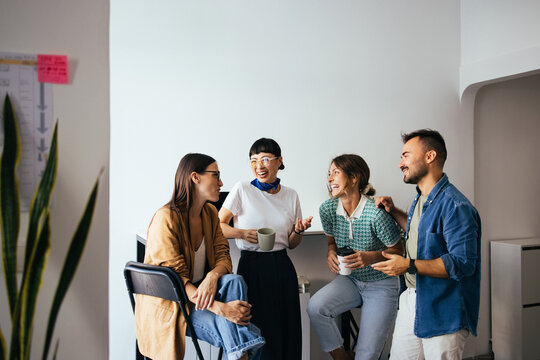 Group of Friendly Colleagues Chatting During Their Coffee Break