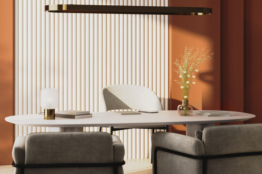 modern office interior with warm terracotta walls and soft sunlight