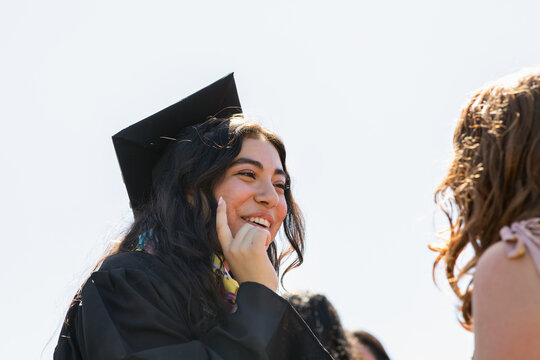 Smiling Cap Graduate Student Conversation