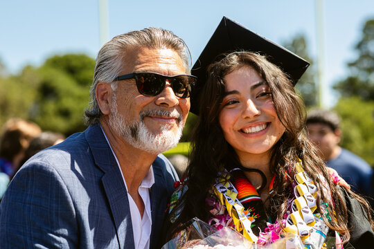 Father and Daughter Celebrate Graduation 