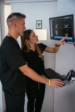 Healthcare professionals analyzing patient x-ray scan for diagnosis