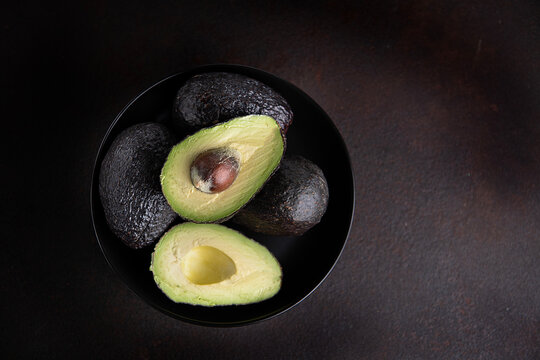 avocado on black plate