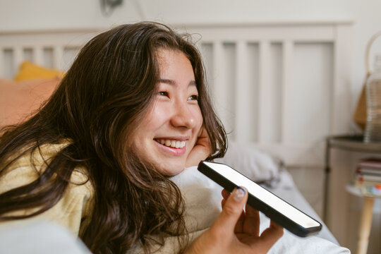 Smiling Girl Enjoys Phone Call