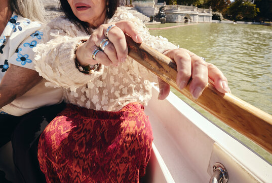 Woman rowing boat on sunny day