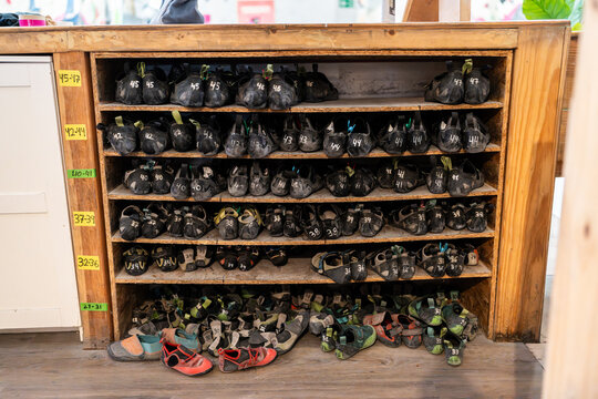 Climbing shoes storage organized by size in bouldering gym