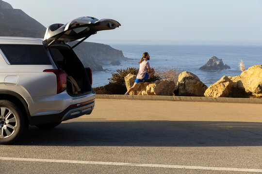 Athlete stretch before run Big Sur landscape 