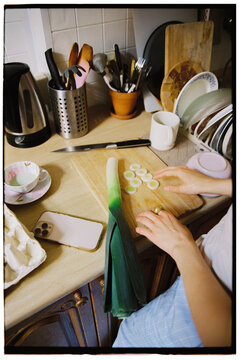 Anonymous woman cooking at the kitchen