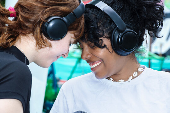 Two Friends Enjoying Music Together at an Outdoor Event