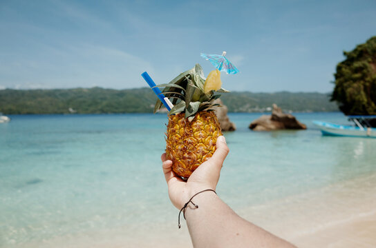 Refreshing Pineapple Drink on a Sunny Beach Day
