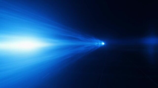Vibrant blue light streaks through dark space with bright glowing core