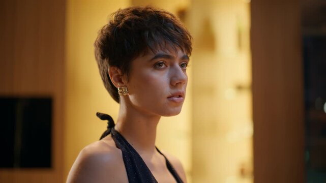 Pensive woman standing night flat alone closeup. Melancholic model waiting date