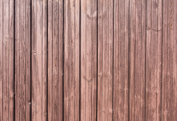 Obraz premium Old wooden boards with cracks as creative background in brown color