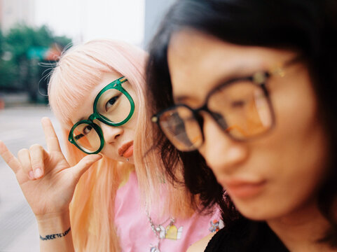 An asian couple wearing glasses